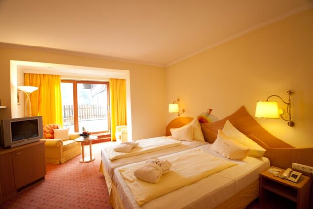 Cosy double room with relaxed furnishings and balcony at Hotel Prägant